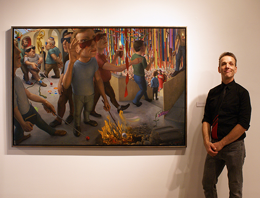 Canadian Artist Michael Abraham stands next to his large oil painting in a gallery exhibition
