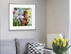 Photo of a warm grey living room with yellow flowers and an art print on the wall titled 'memento mori'